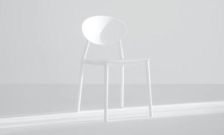 A white chair in a light room 